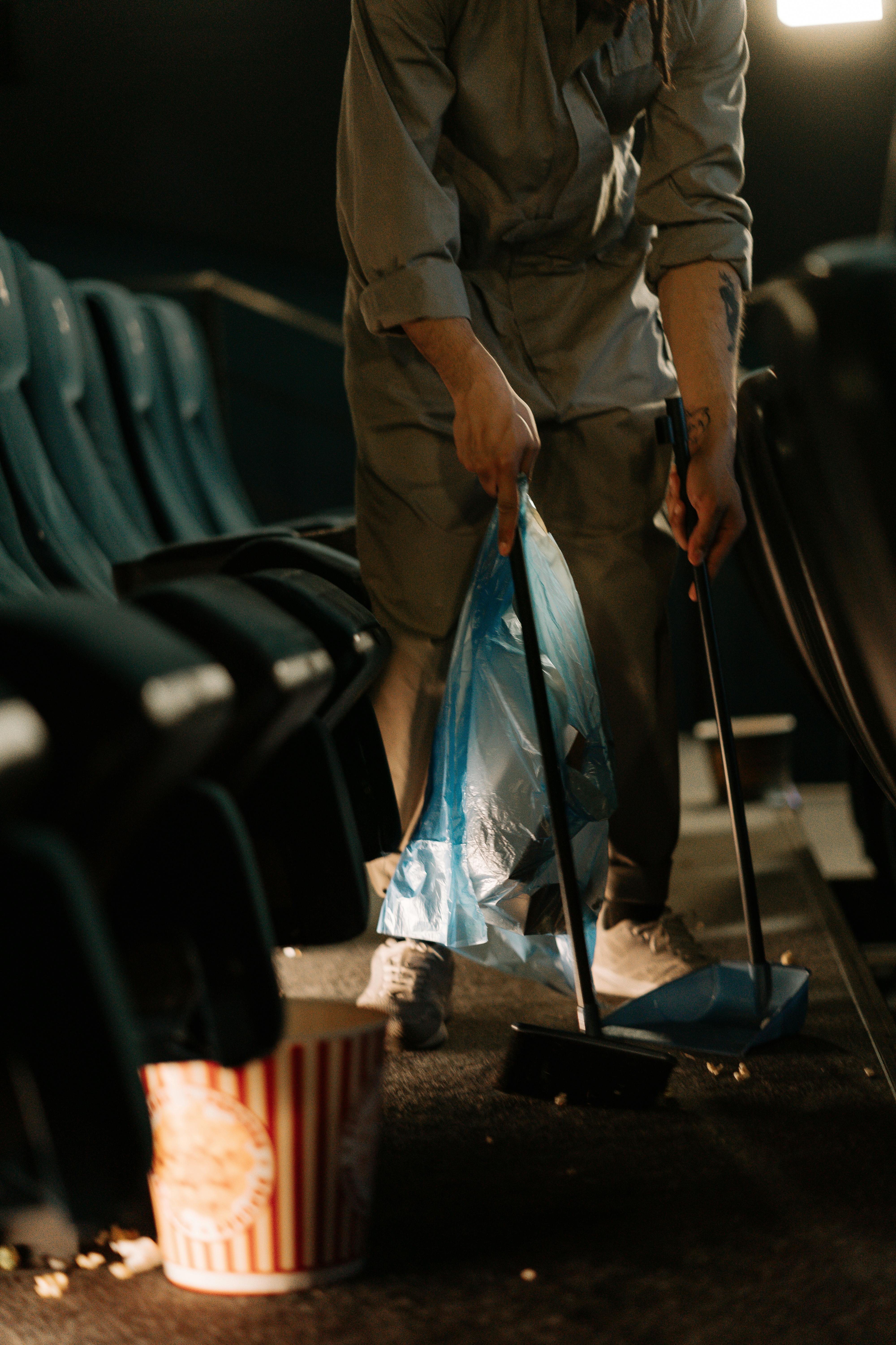Person Sweeping Inside a Movie Theater · Free Stock Photo