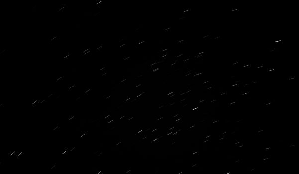 Captivating image of star trails captured with long exposure depicting celestial motion.
