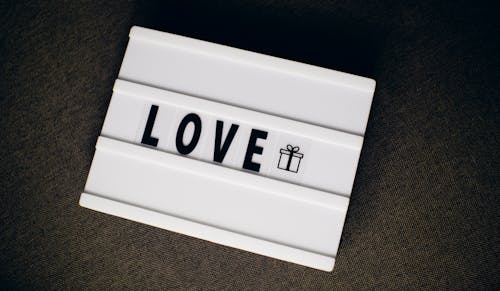 Close-Up Shot of a Sign that Says Love