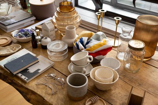 Explore a curated mix of home decor items elegantly arranged on a wooden table.