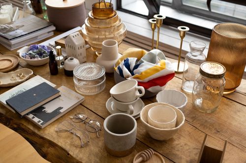 Free Explore a curated mix of home decor items elegantly arranged on a wooden table. Stock Photo