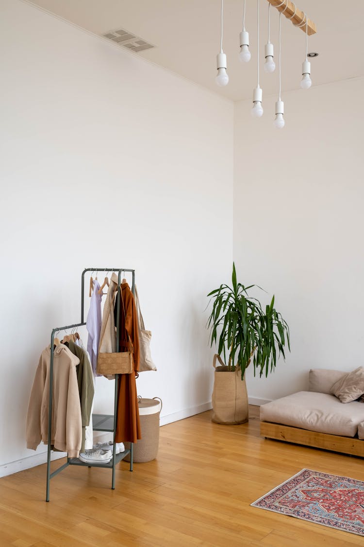 Clothes Hanging On Metal Rack