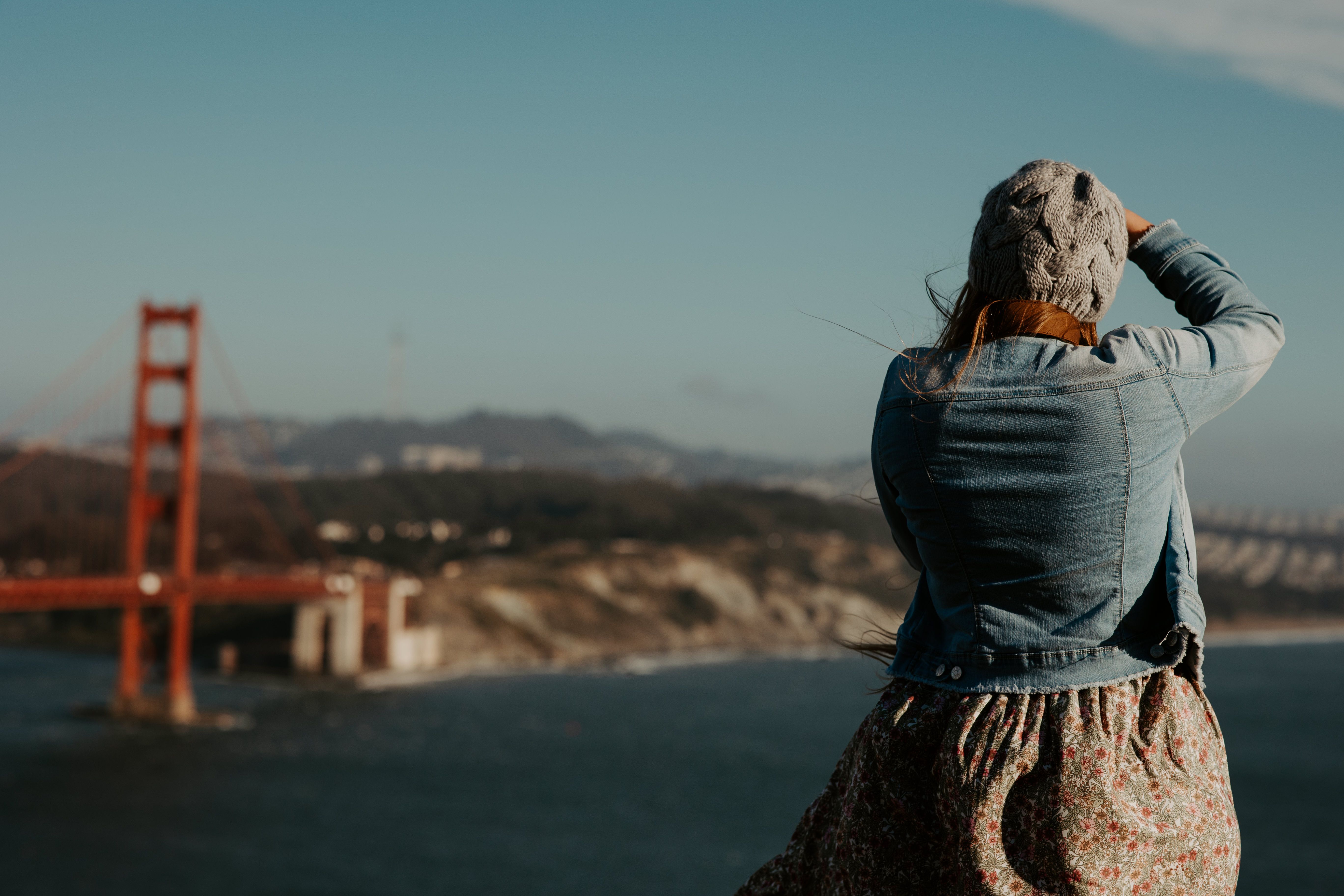 Back View of a Woman in a Denim Jacket · Free Stock Photo