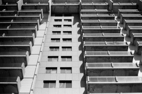 Free Black and White Photo of a Building with Balconies Stock Photo