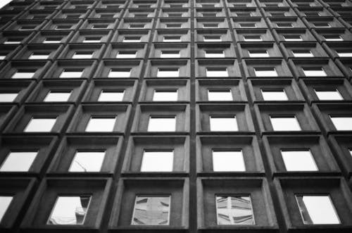 Free Grayscale Photo of Building Windows Stock Photo