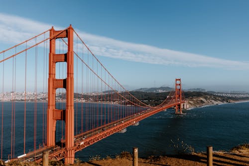 Golden gates crossing calm sea