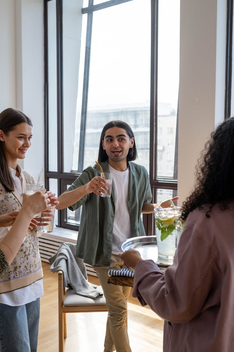 People Holding Drinks With Drinking Straws