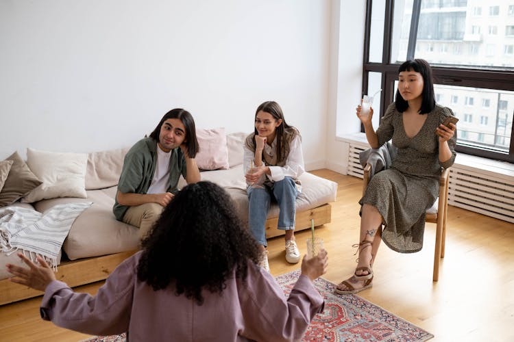 A Group Of People In A Living Room