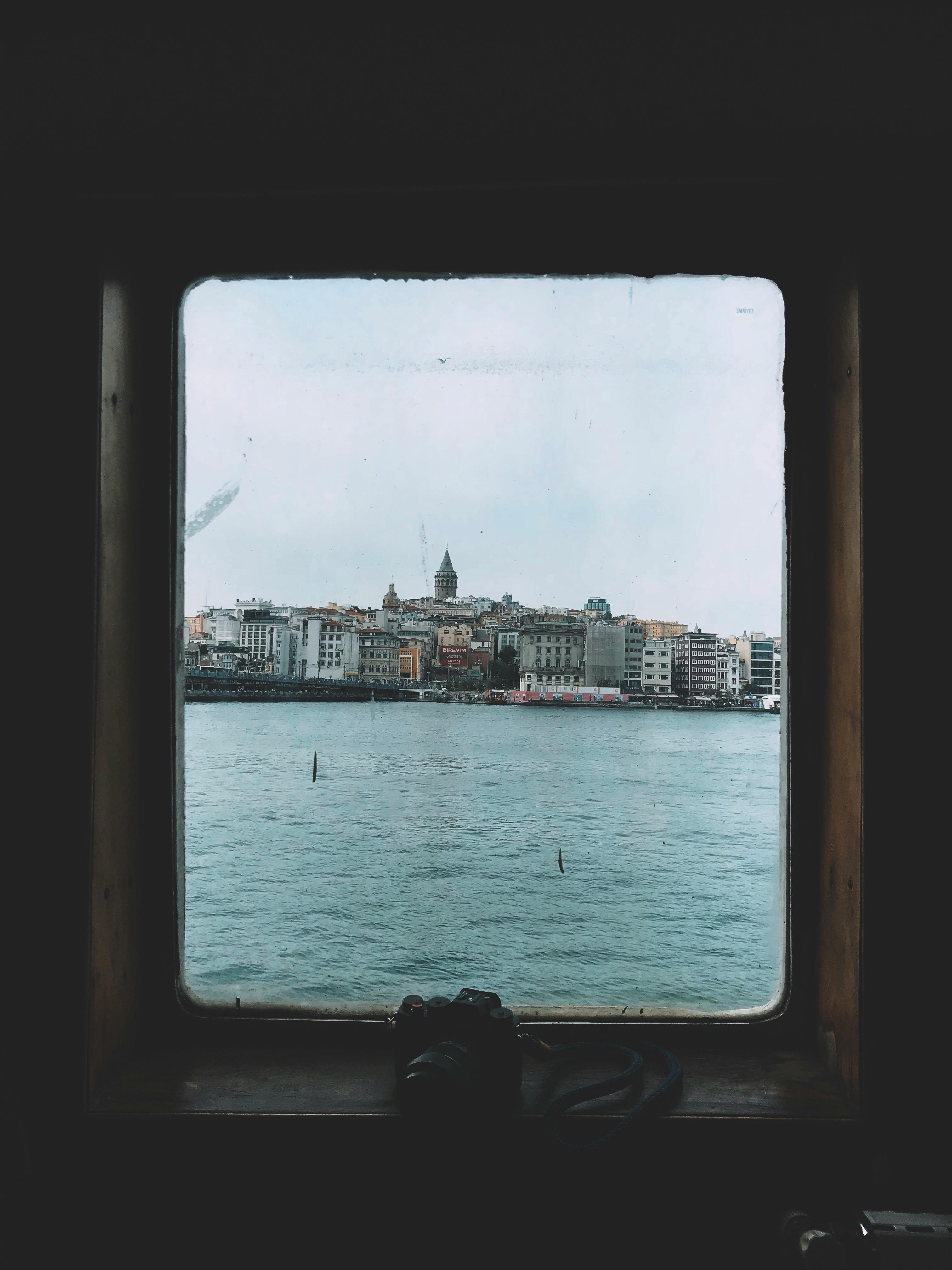 a view of an island city through a window