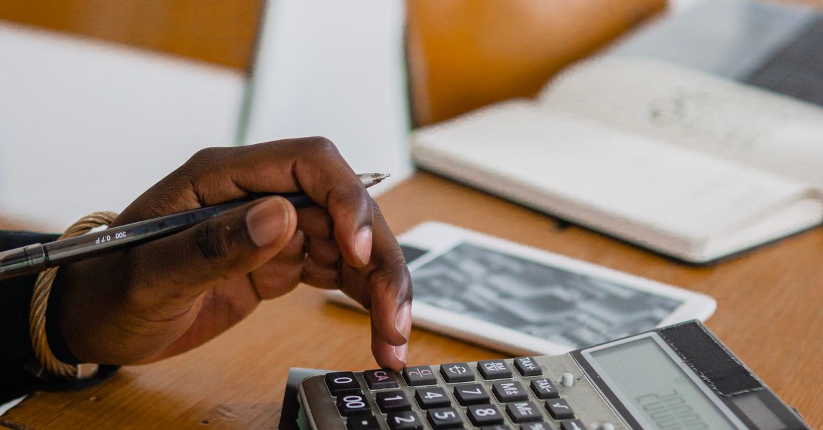 Calculator User A Person Using a Calculator · Free Stock Photo