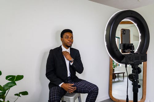 Free 
A Man in a Blazer Vlogging Stock Photo