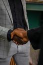 Close-Up Shot of Two People Shaking Hands
