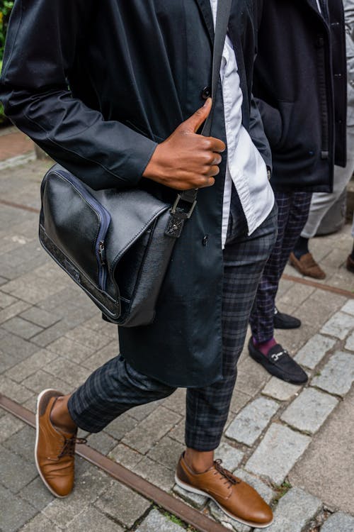 Close-Up Shot of Person Carrying a Bag