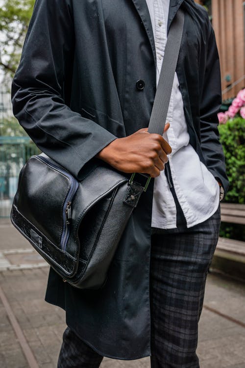Free A Person Wearing a Black Sling Bag Stock Photo