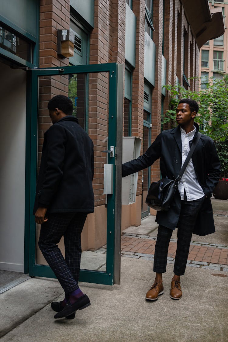 Men Entering A Building