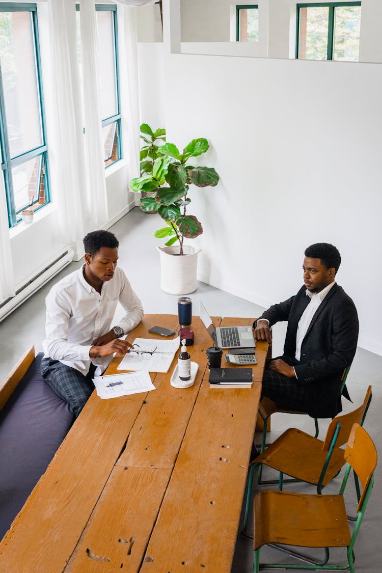 Men Working Together At An Office