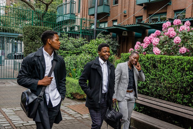 Photo Of Men Walking Together