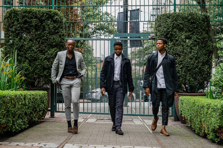 Men In Their Corporate Attire Walking Together