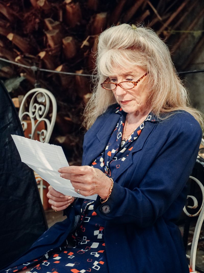 Mature woman in a blue coat with vintage style