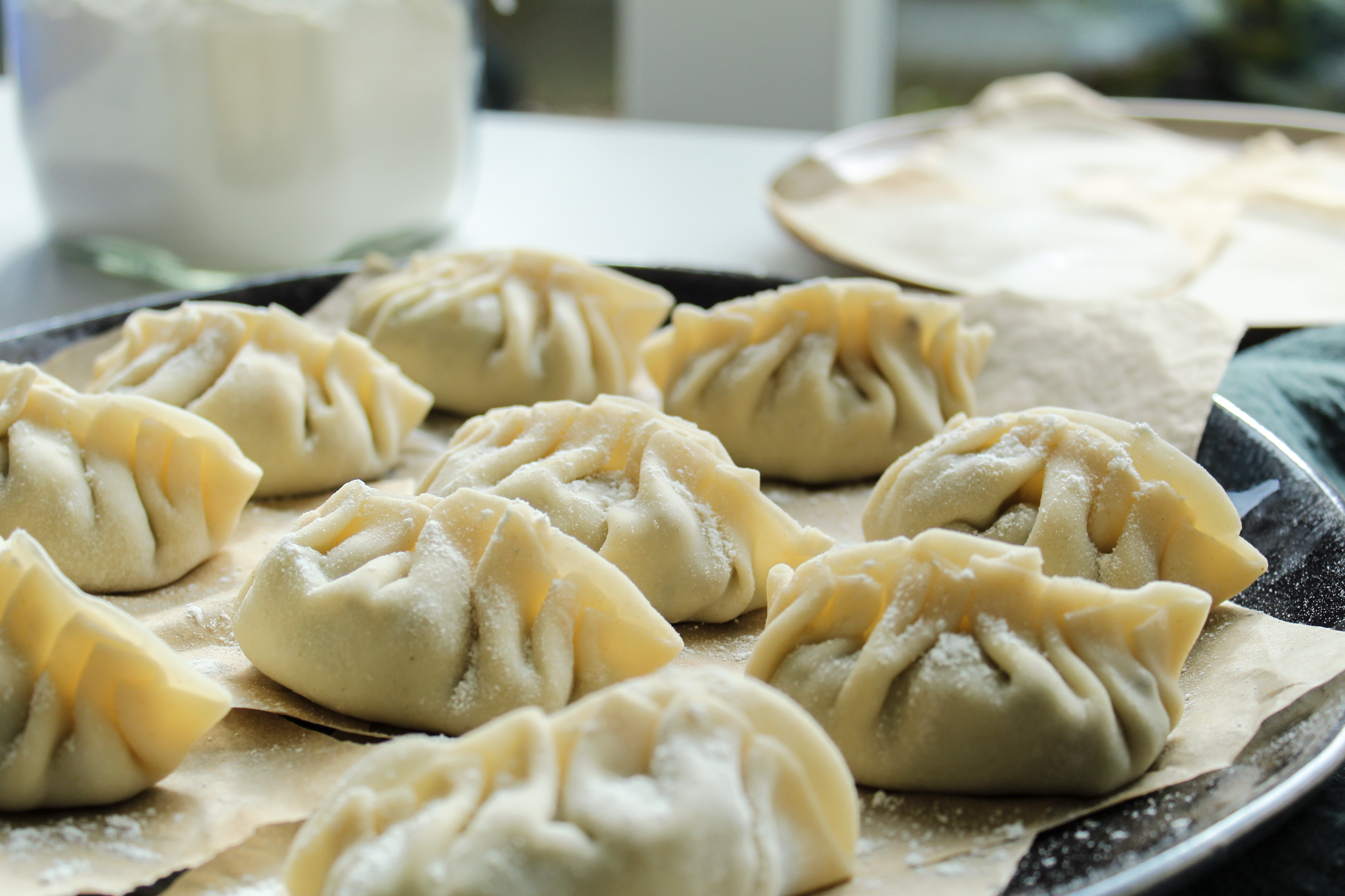 Close-Up Shot of Raw Dumplings on a Tray · Free Stock Photo