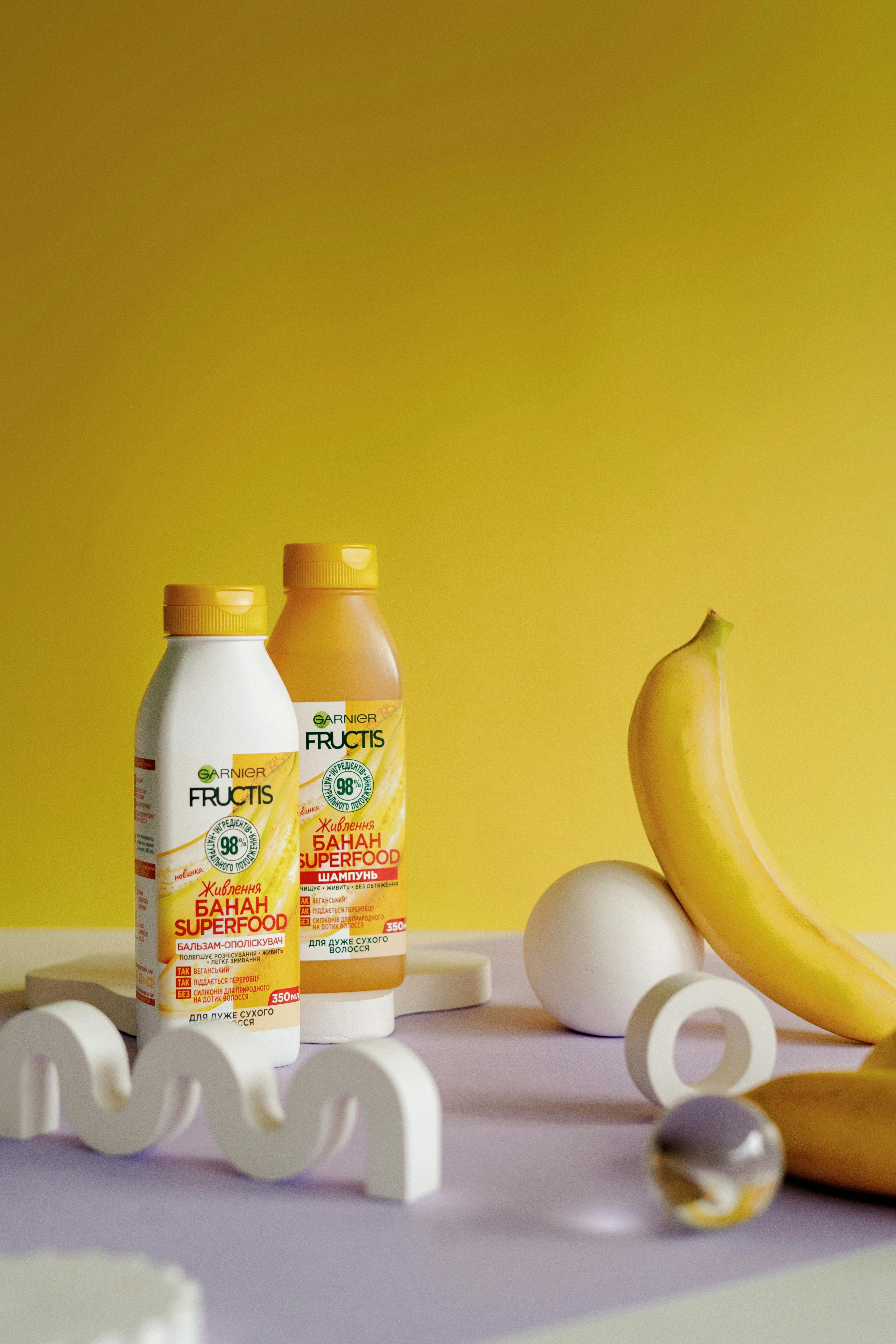 Vibrant product photography featuring Garnier Fructis Banana Hair Food.