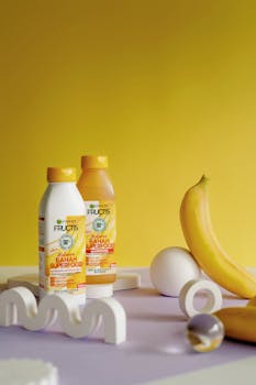 Vibrant product photography featuring Garnier Fructis Banana Hair Food.