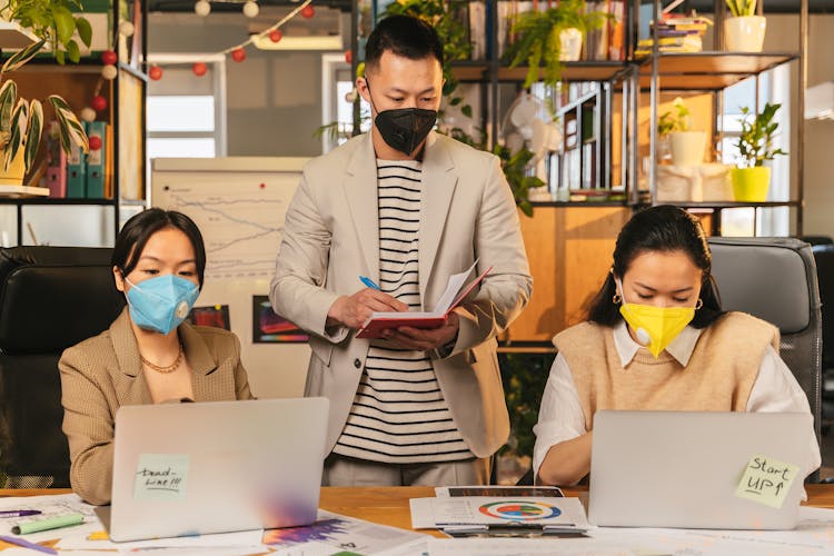 People Wearing Face Masks While Working 