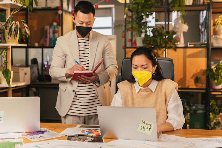 Man And Woman Working In Office