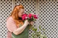 Girl in Pink T-shirt Holding Pink Flower Bouquet