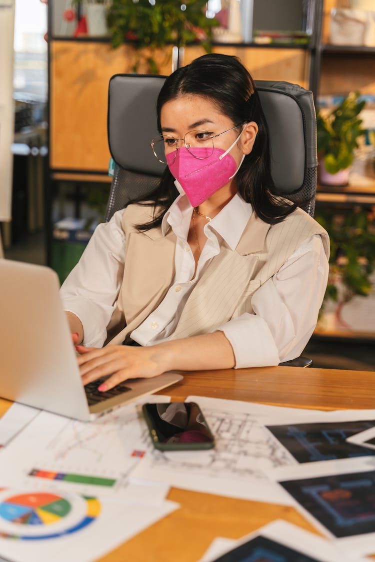 Woman In Face Mask Working In Office 