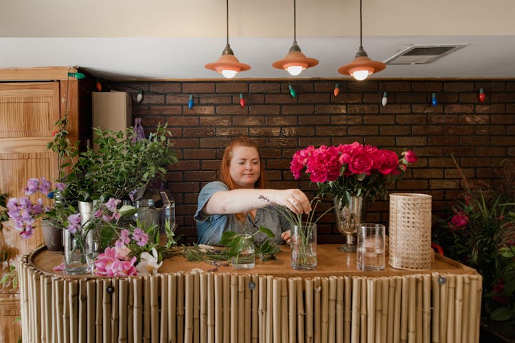 Pretty Woman Arranging Flowers