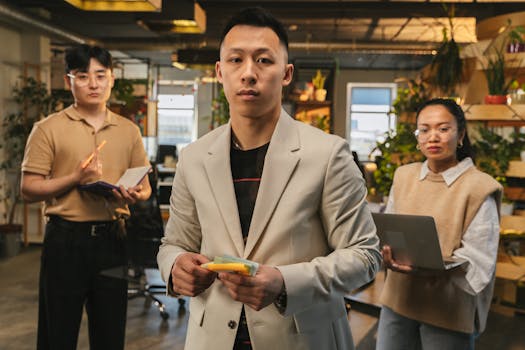 Group of professionals collaborating in a stylish, plant-filled office space.