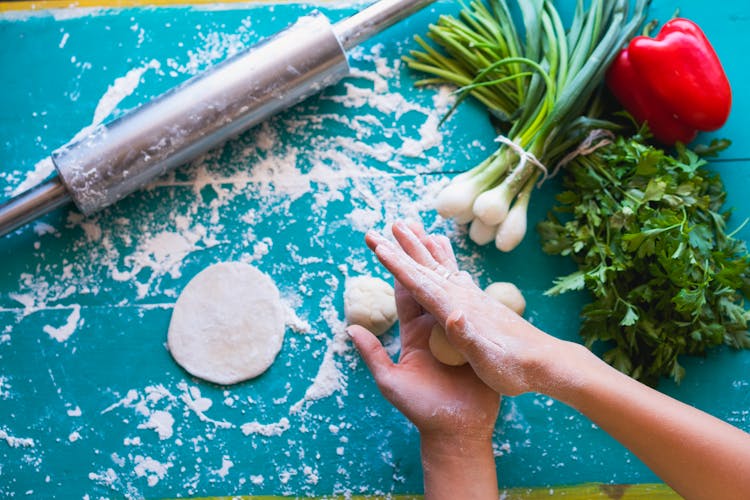 A Person Kneading Dough