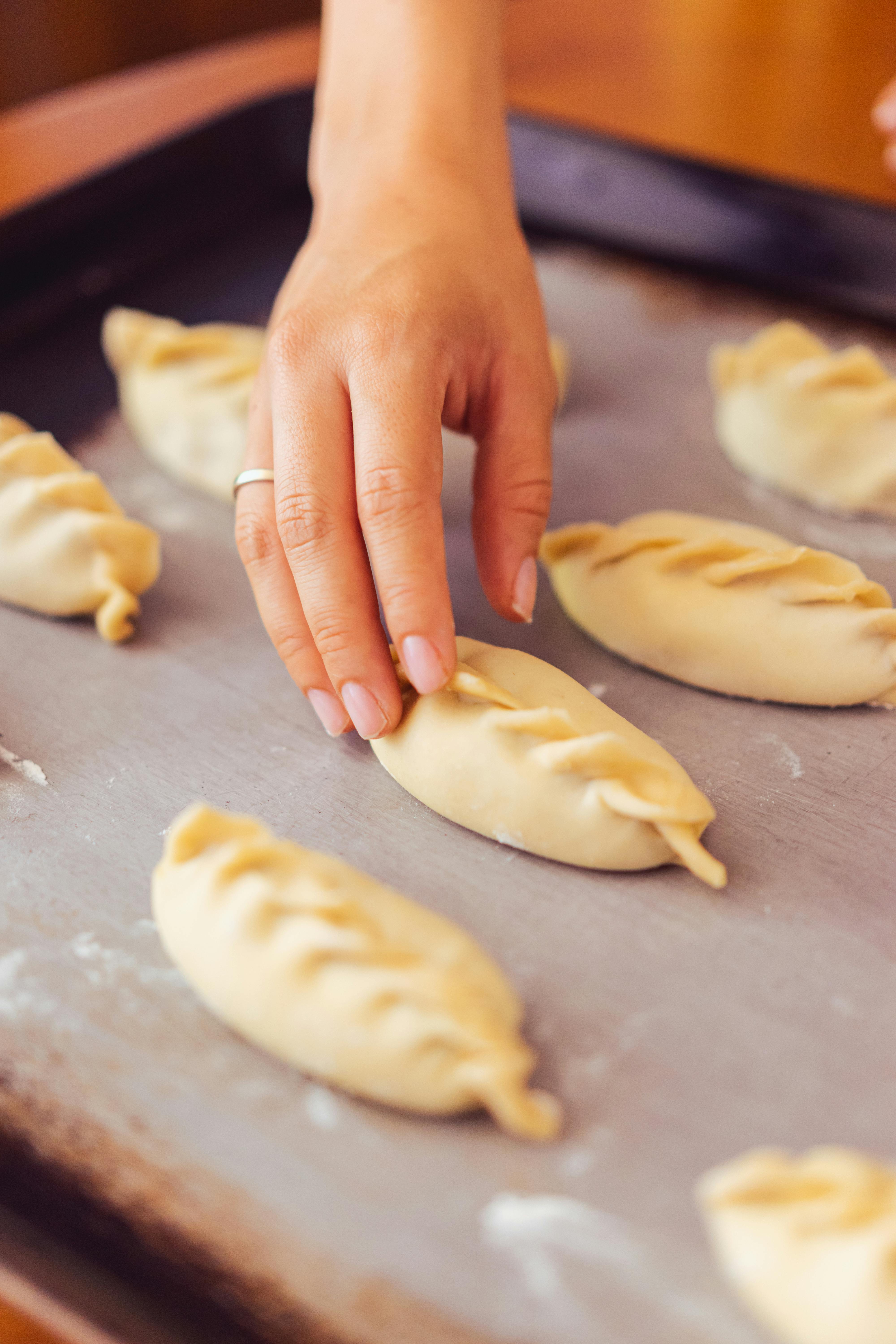 a person holding a dough