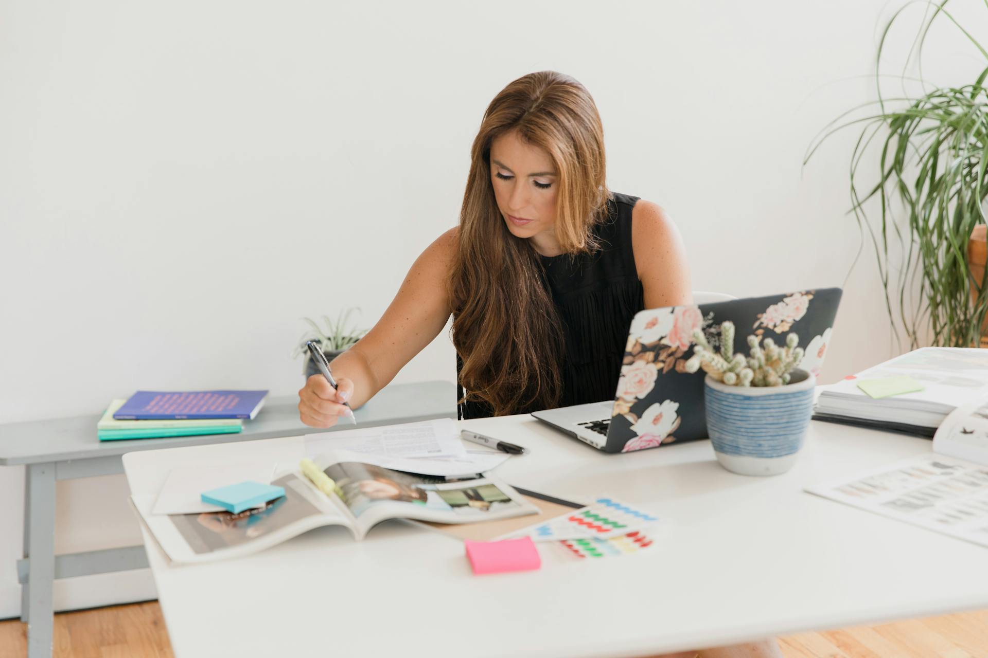 A Busy Woman Working on Her Laptop