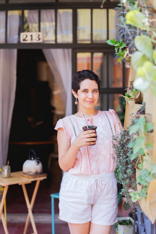 A Woman holding a Cup