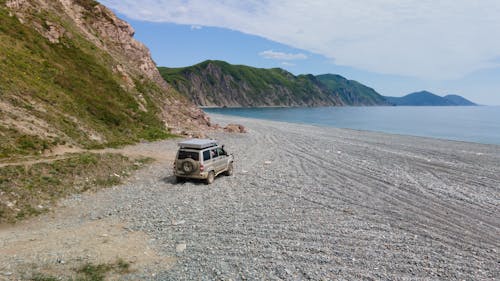Vehicle Driving on Beside Seashore