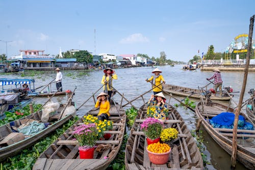 People Riding on Boats on Body of Water