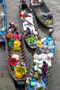 Colorful boats at a bustling floating market in Vietnam, showcasing local culture and commerce.