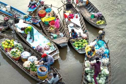 Free Vendors with Boats at a River Stock Photo
