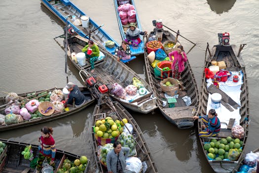 Colorful aerial photo of a bustling floating market in Vietnam's rural area.