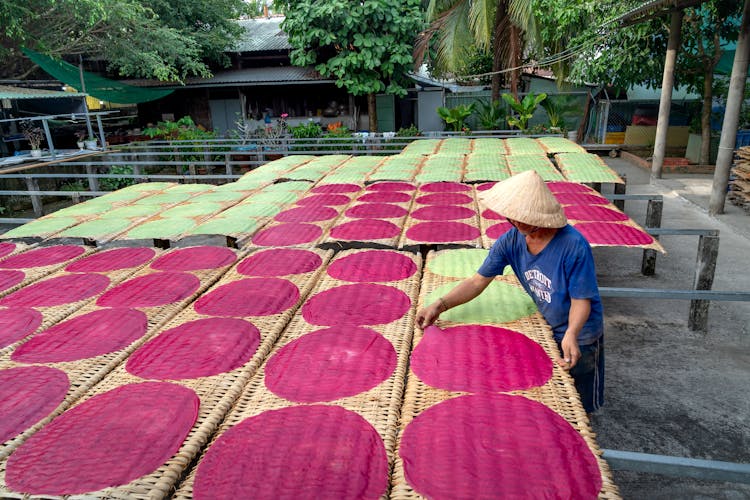 Man Putting Rice Cake To Sun Dry 