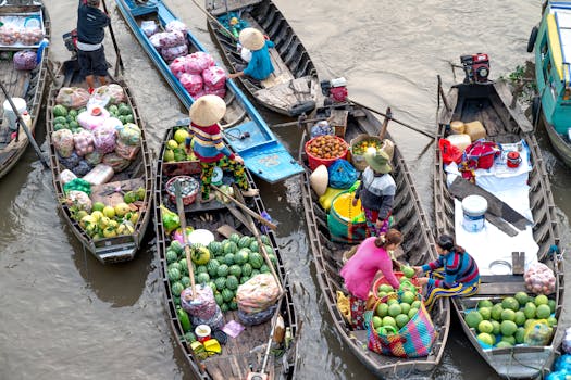 A colorful and bustling floating market with vendors selling fresh produce from boats on the river.