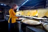 A Woman in Yellow Long Sleeve Shirt
