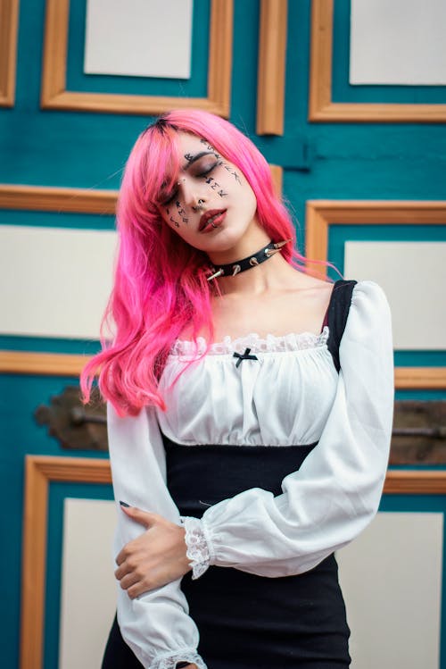 Woman in Black and White Dress With Pink Hair