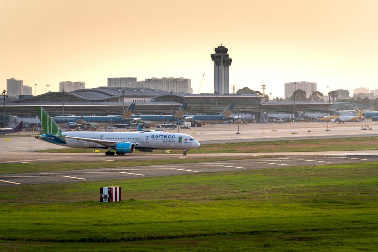 An Airplane Of Bamboo Airways Parked On A Runway