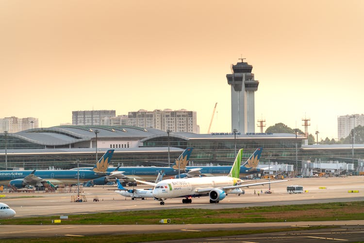 Airplanes Parked On A Runway