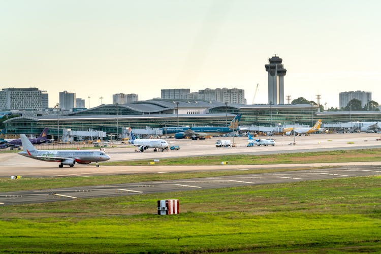 Airplanes Parked On A Runway