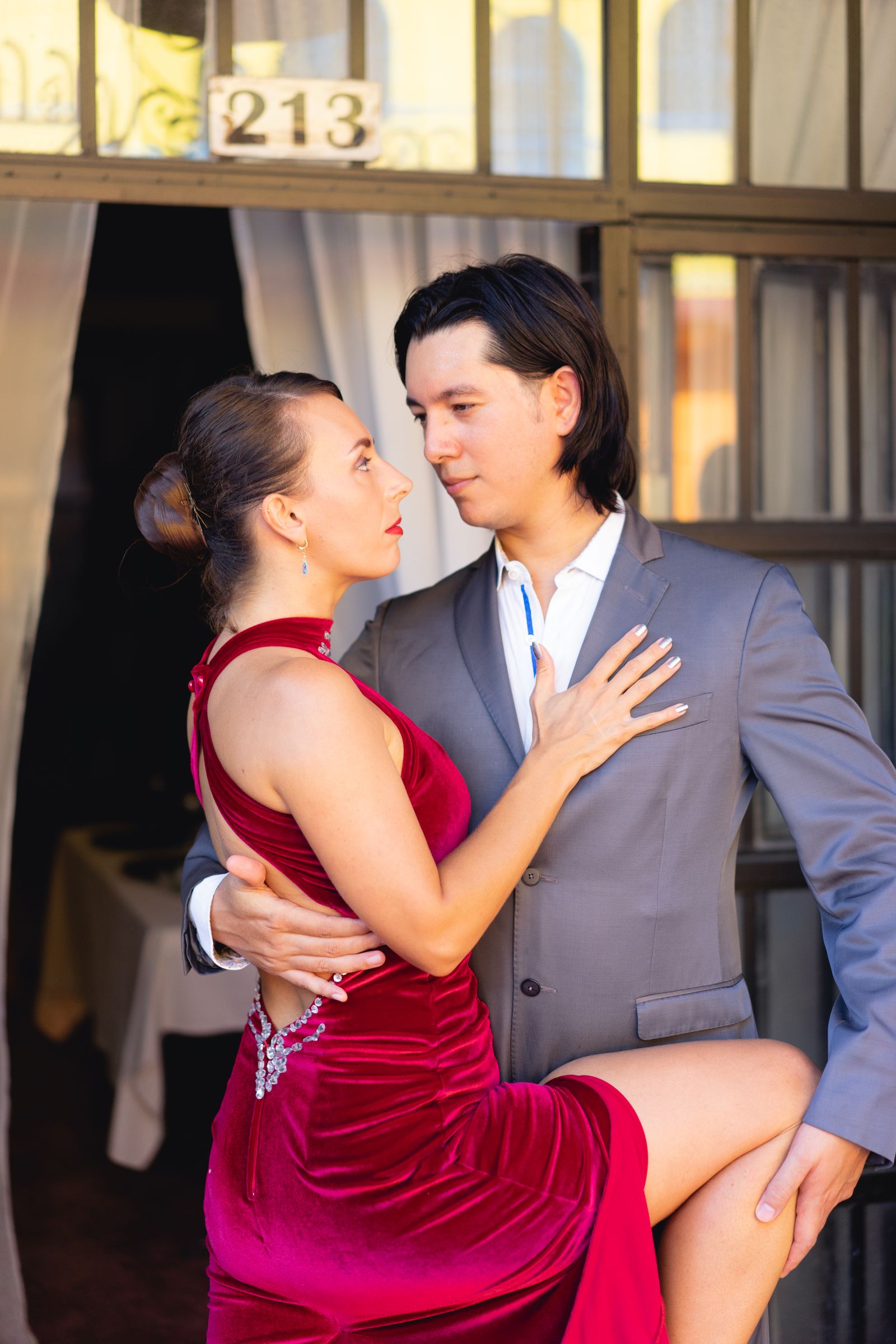 Bolero — romantic couple in a close slow-dance embrace. Stock photo.