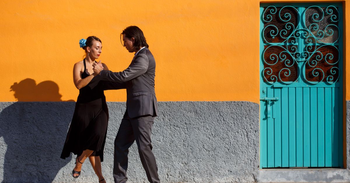 Couple in an abrazo during a milonga